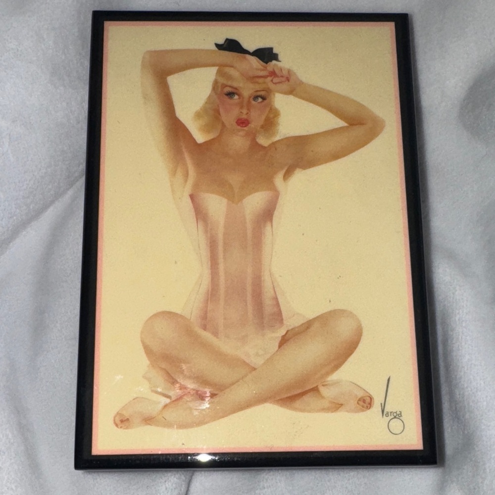 Vintage Black lacquered box with a mid-century pin-up art lid, signed 'Varga'.